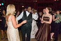 People dancing and singing at a party.